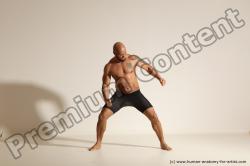 Underwear Gymnastic poses Man Black Muscular Bald Dancing Dynamic poses Academic